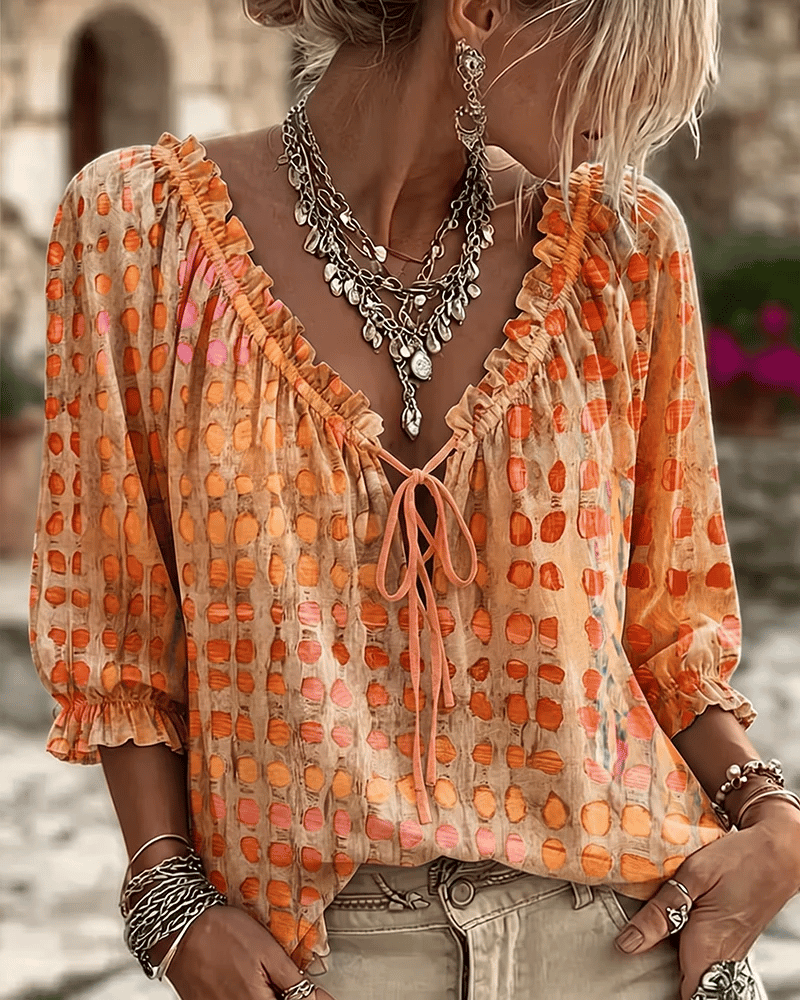 PIA | polka dot blouse with a V-neck