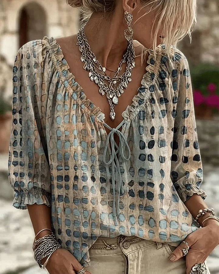 PIA | polka dot blouse with a V-neck