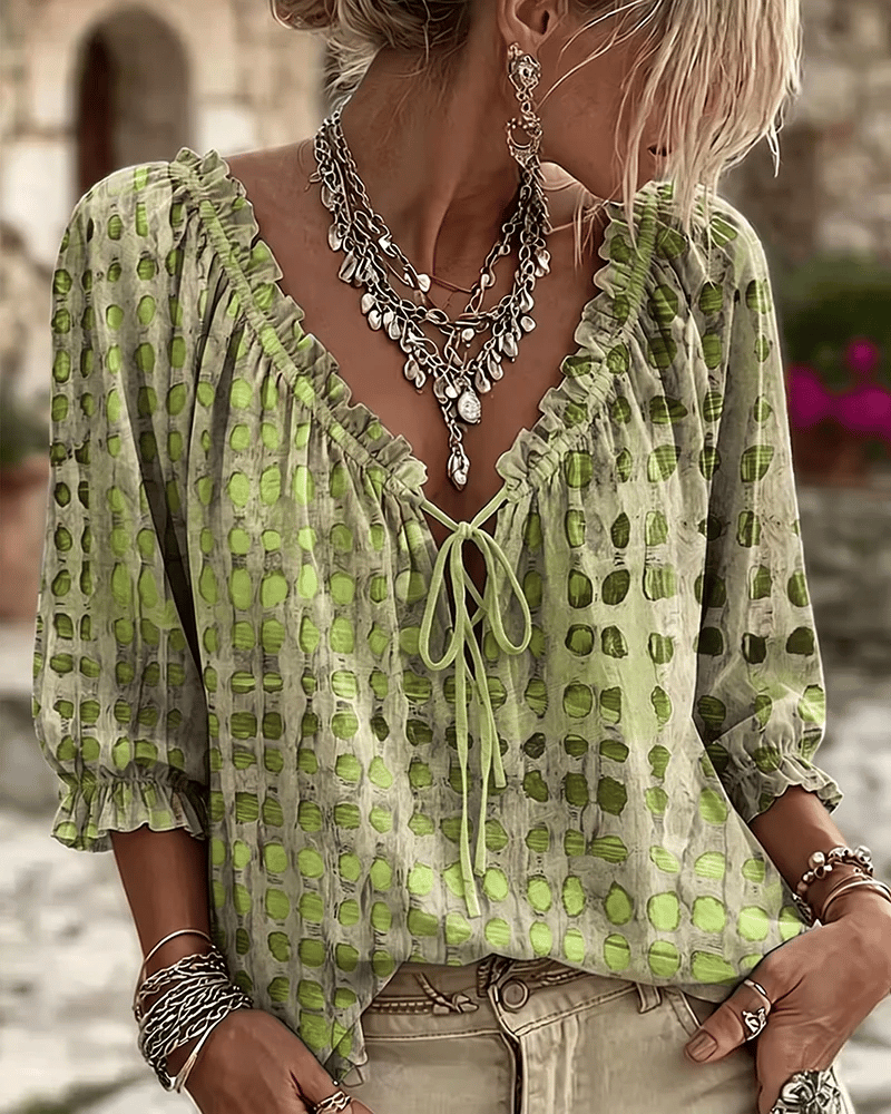 PIA | polka dot blouse with a V-neck