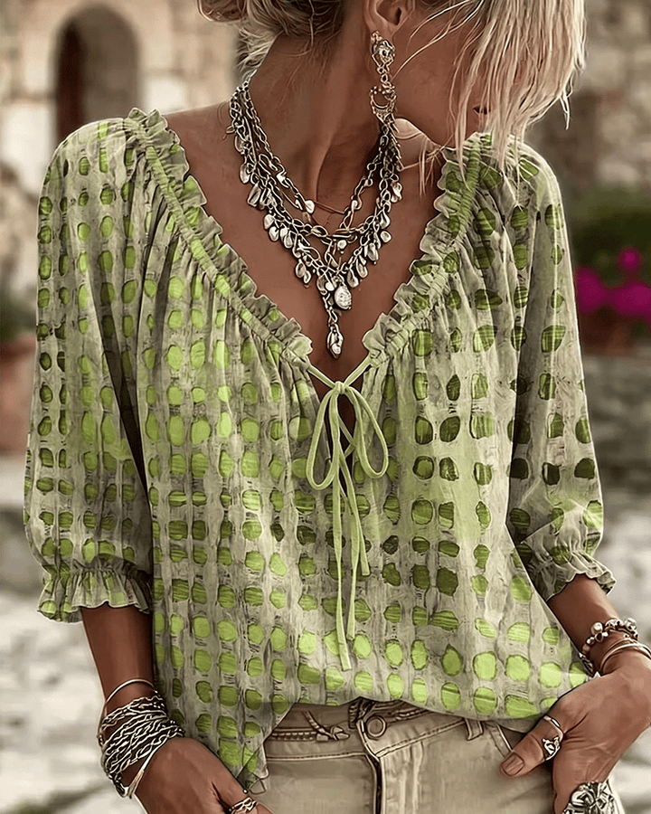 PIA | polka dot blouse with a V-neck